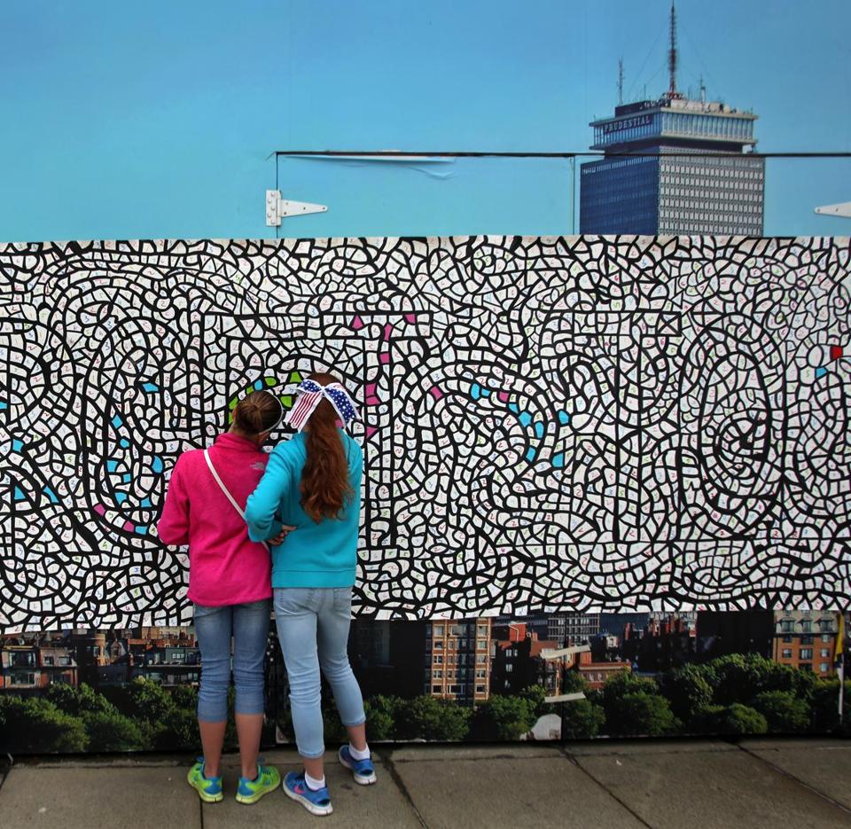 A 60-foot community mural was created outside of the Prudential Center on Memorial Day last year. Photo: Globe file