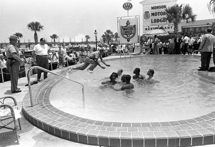  When the group of white and black integrationists refused to leave the motel's pool, this man dived in and cleared them out. All were arrested. Horace Cort/AP